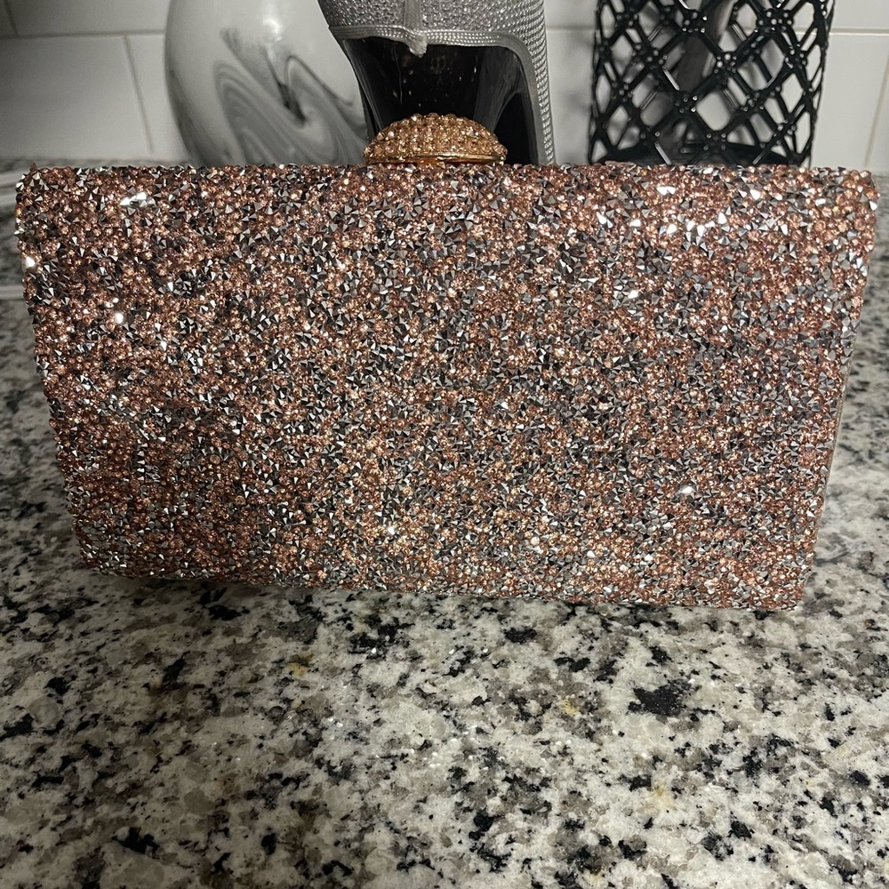Beautiful multi color clutch…never been worn.